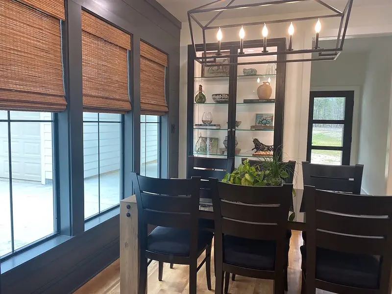 Dining room with woven wood shades